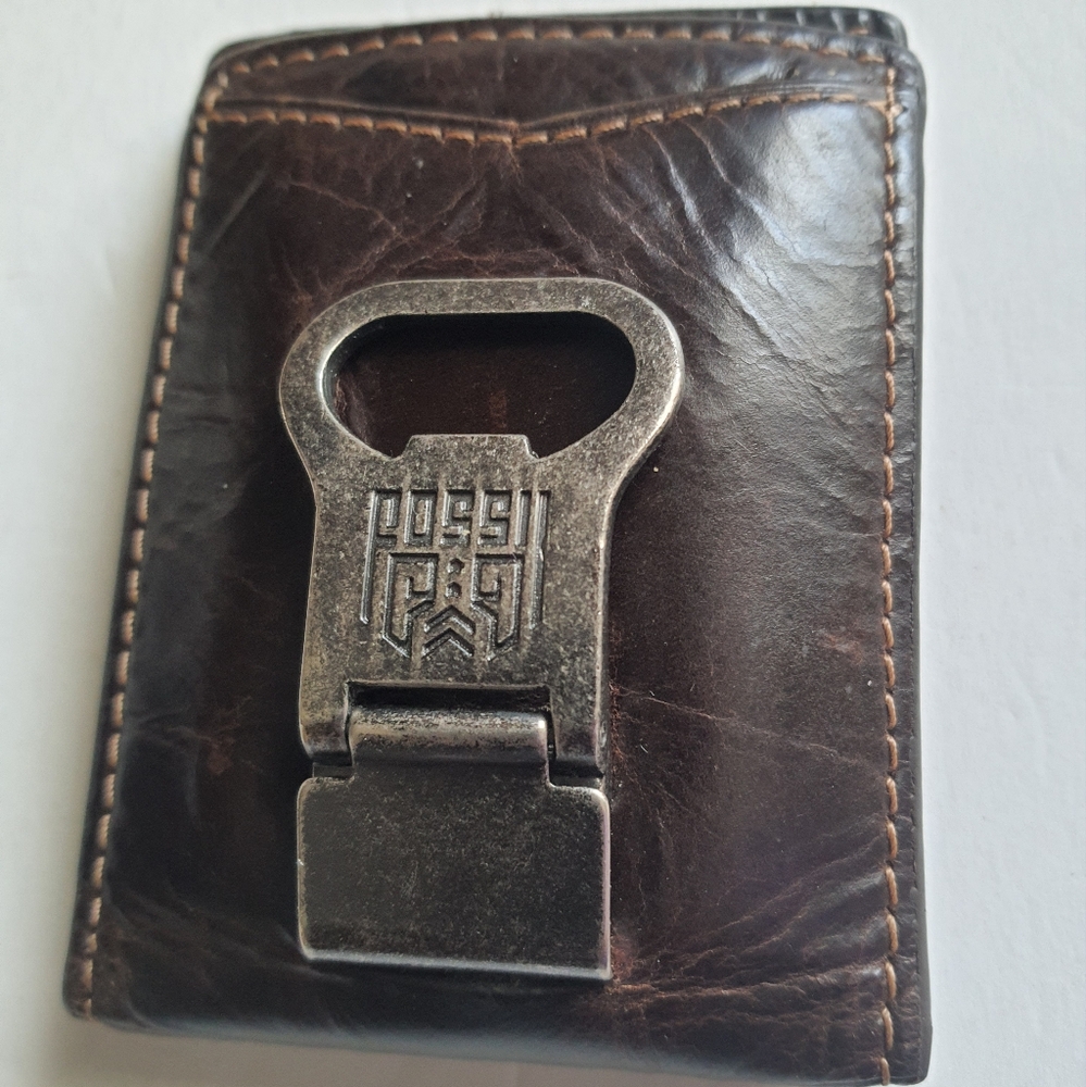 Fossil wallet with bottle opener attached